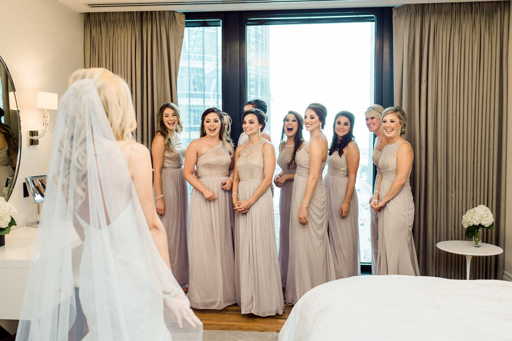 Day of Coordinator: The Simply Elegant Group,  Elisa | Bridal Prep:  The Langham Chicago | Groom Prep:  State and Chestnut Apartments | Ceremony:  St. Michael Church in Old Town | Reception:  Loews Chicago O’Hare Hotel  (Rosemont)| Bridal Dress:  Nordstrom  designed by  Monique Lhuillier | Bridal Shoes:  Vince Camuto | Groom & Groomsmen tuxes:  Black Tie Formalwear  designed by Ike Behar| Makeup:  Niki Spano | Hair:  PURE Salon & Spa | Floral:  Natural Beauties Floral | Cake:  Cake Sweet Foods | Band:  Maggie Speaks | Photography:  Dabble Me This | Wedding Cinematography:  Delack Media Group