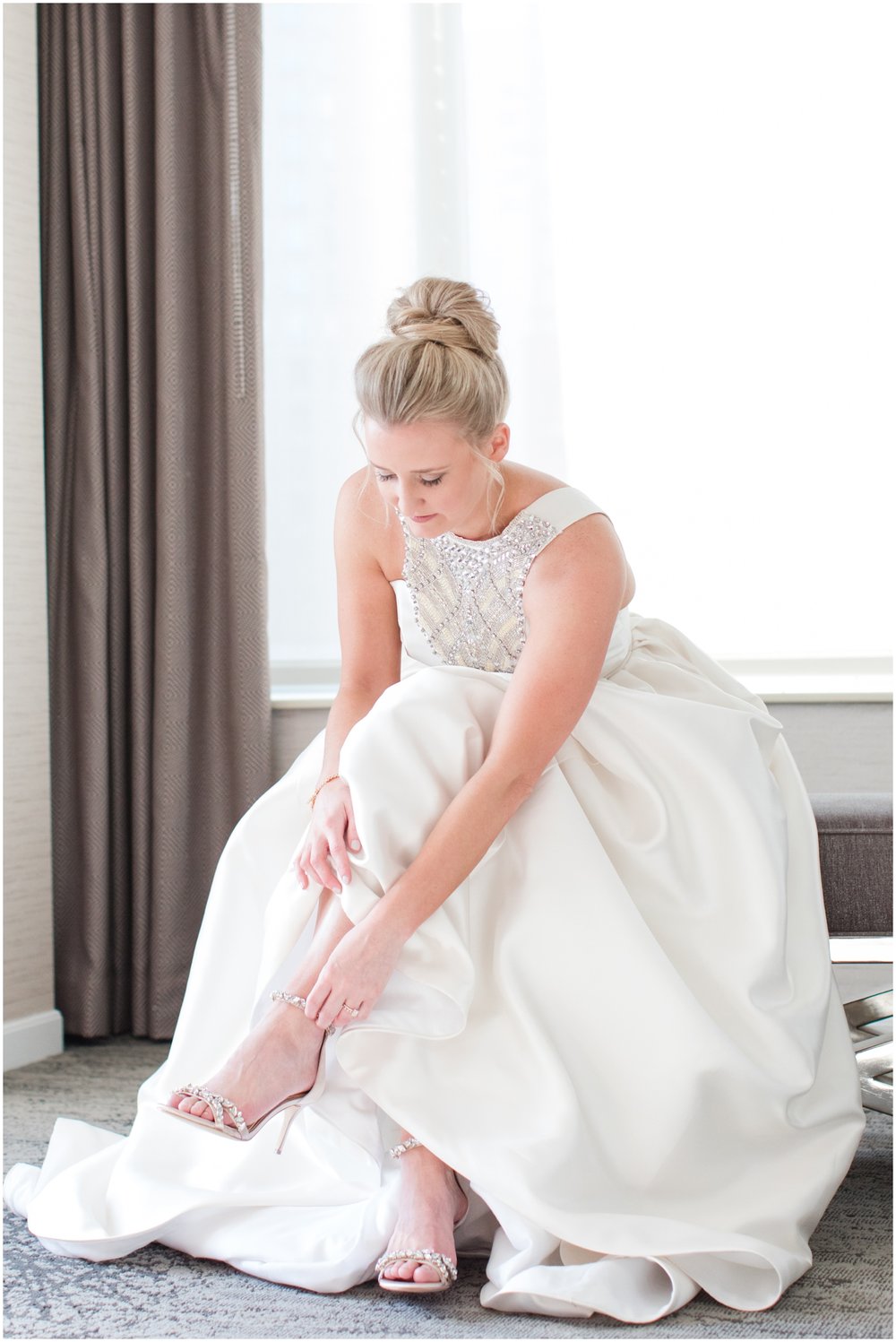  bride putting on her wedding shoes 