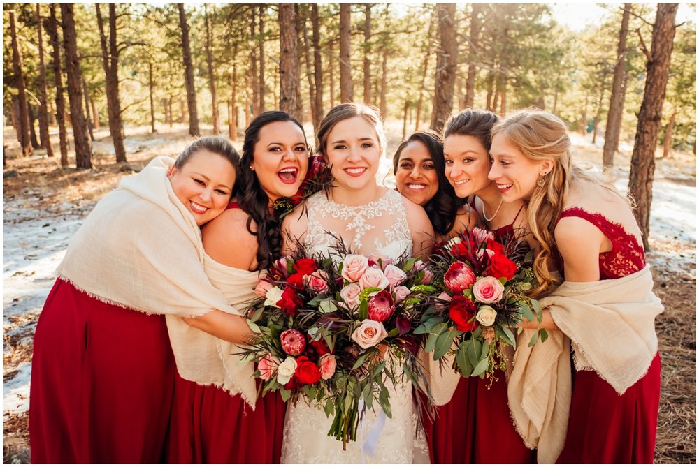  bridesmaids holding their bouquets  