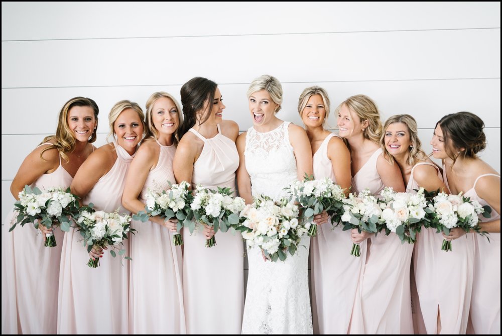  bridesmaids holding wedding bouquets 