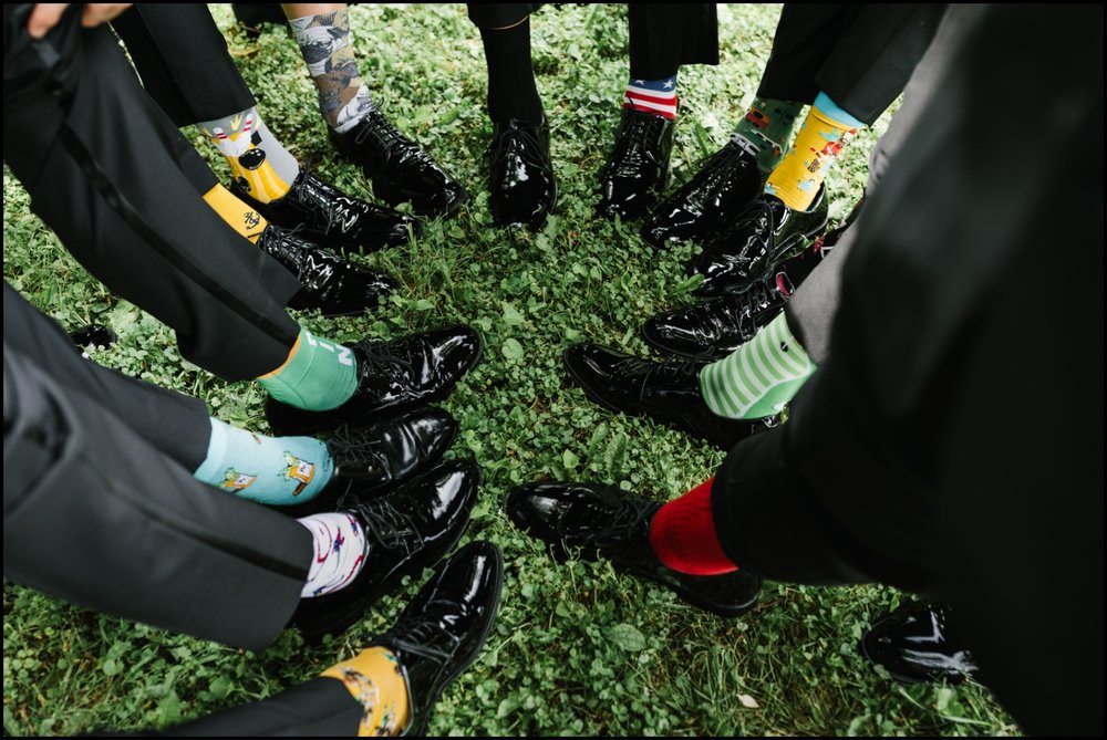  groomsmen wearing silly socks  