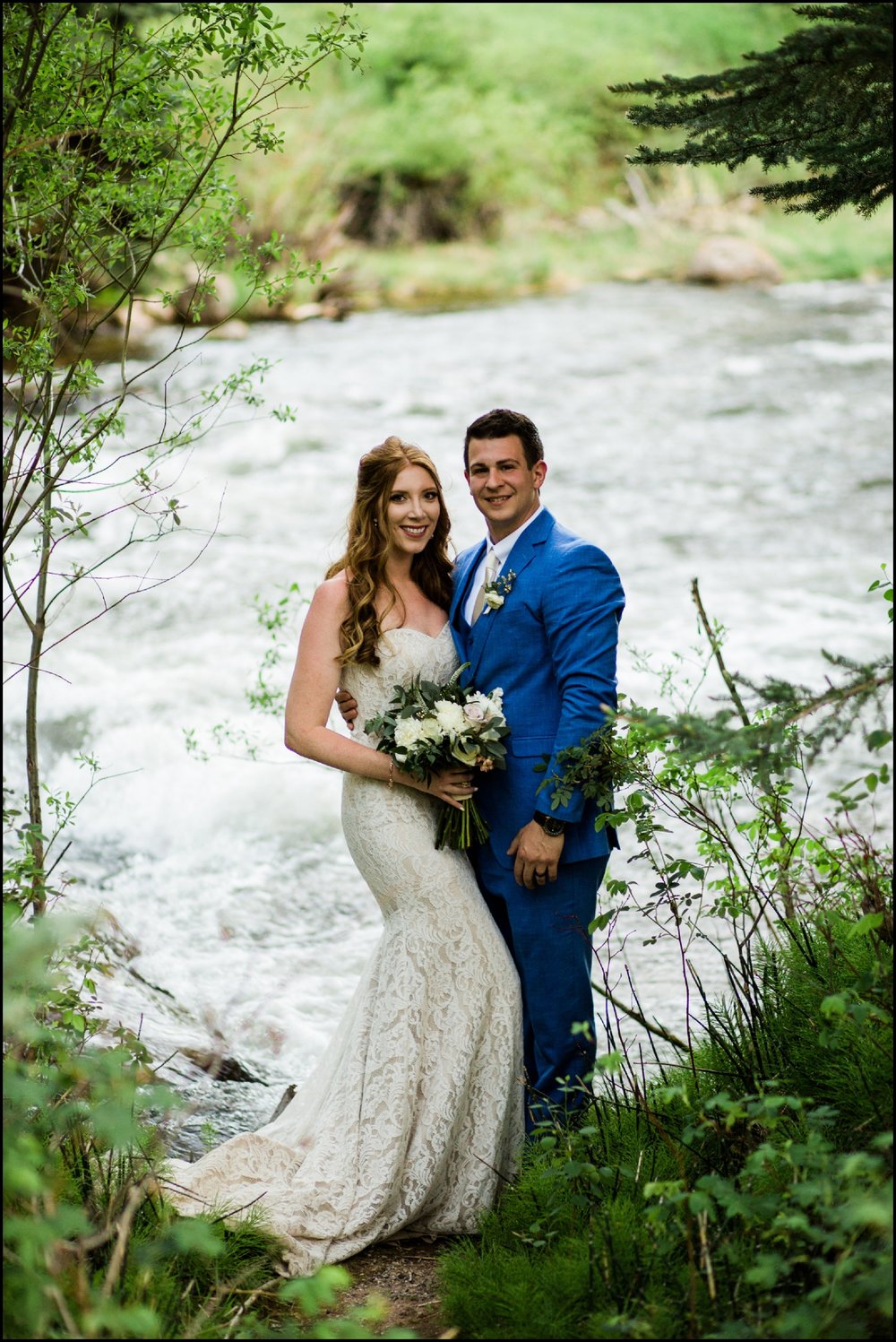 Bride and groom by river at Donovan Pavilion wedding 