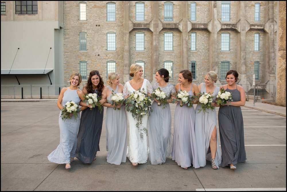  Bridesmaids holding bridal bouquets 