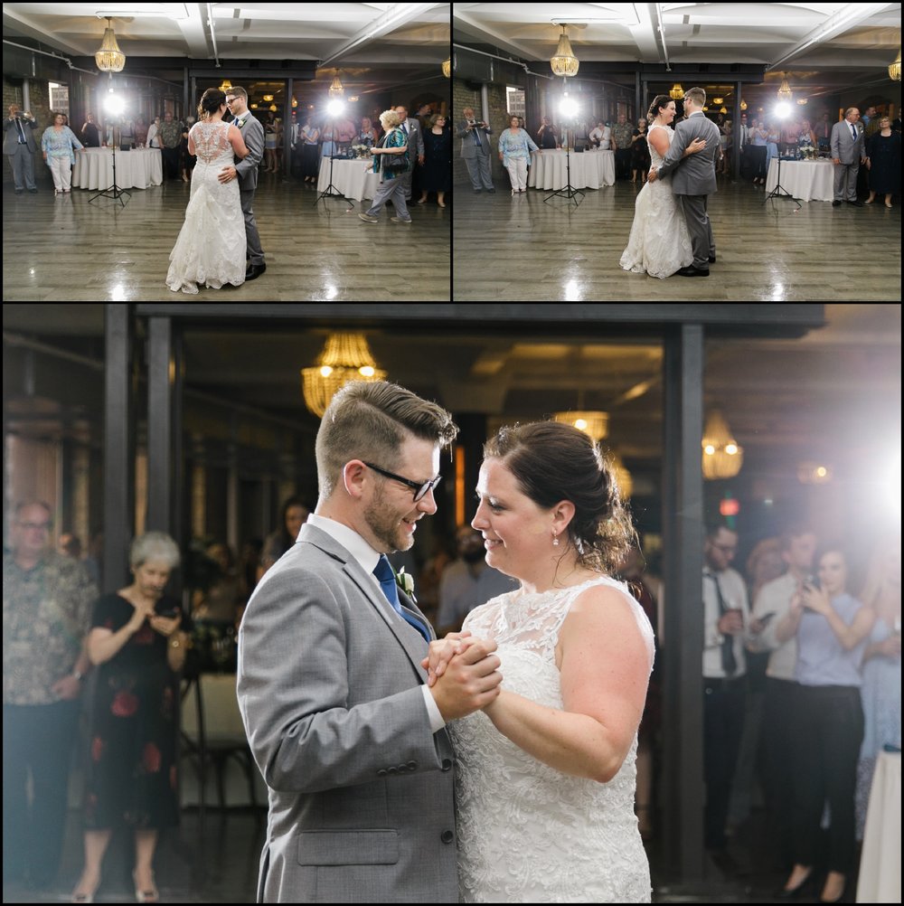  Bride and groom dance at their wedding reception 