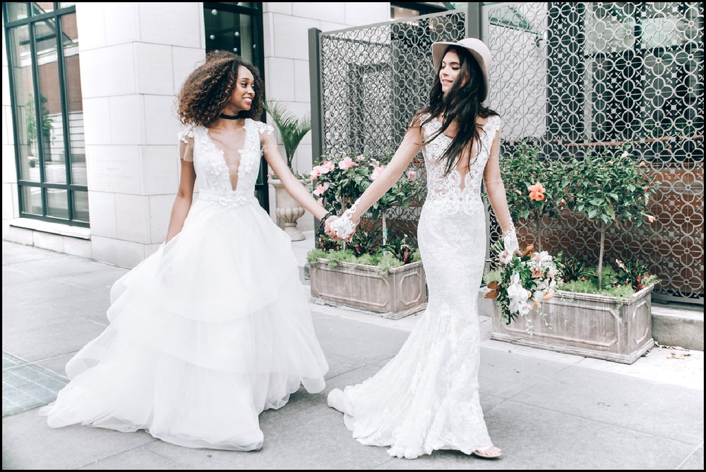two brides walking outside the Hotel Ivy in Minneapolis