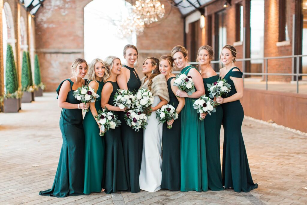 Bridal party posing in Bridgeport Art Center's Sculpture Garden wedding venue