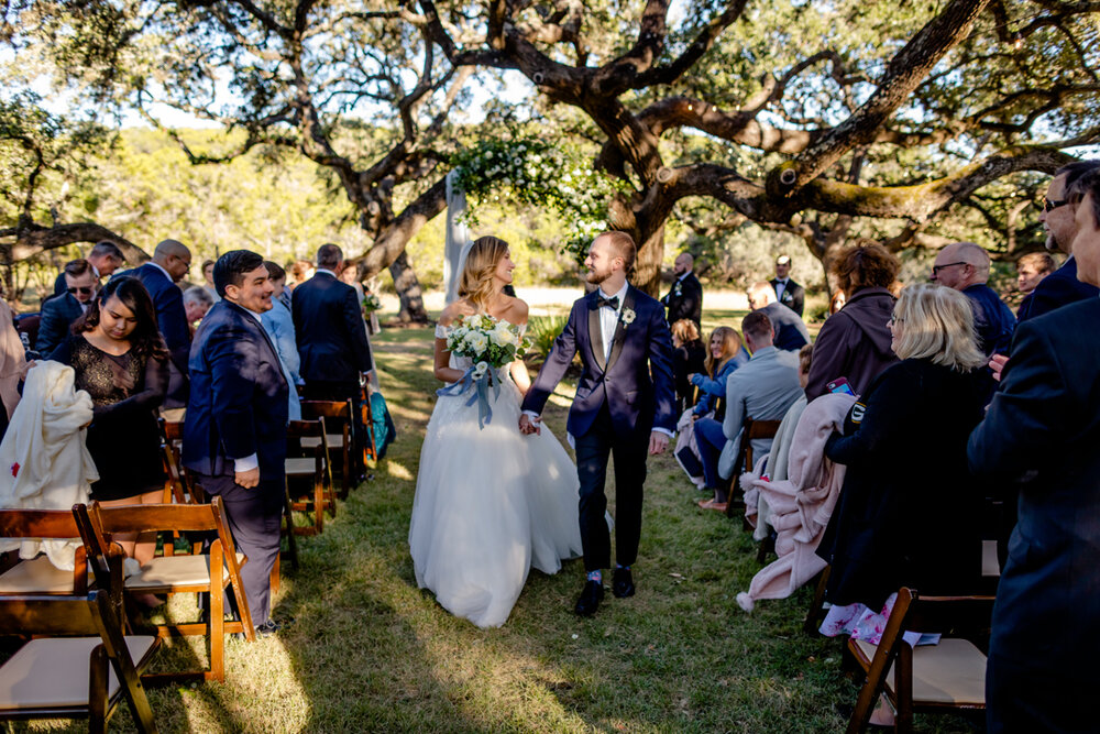 Bride and groom recessional at the Ivory Oak