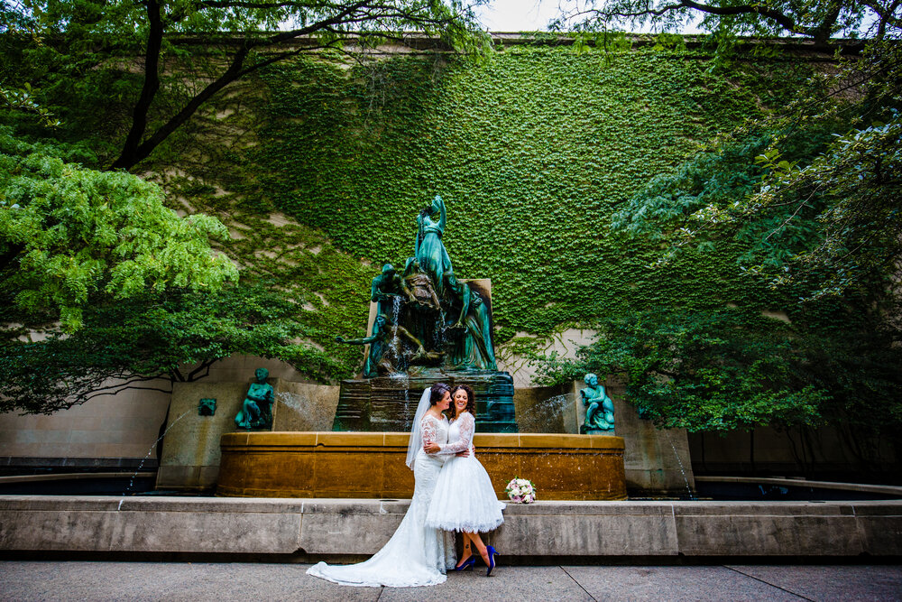 two brides outside fountain at Art Institute of Chicago wedding