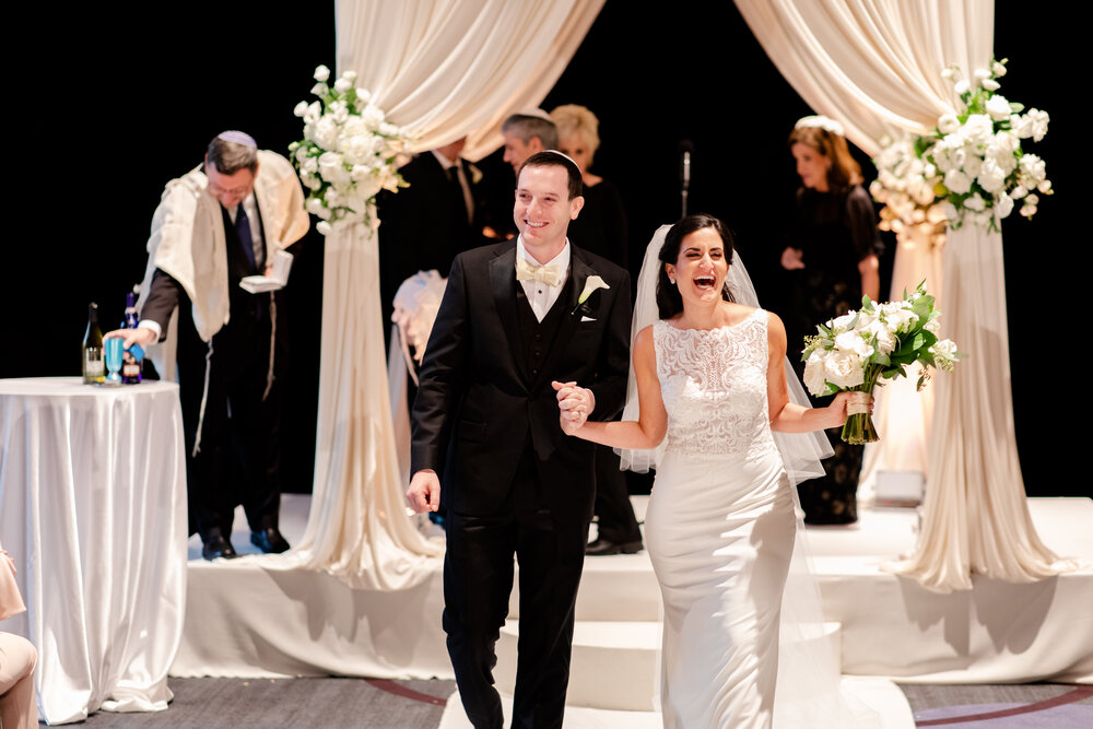 Bride and groom recession at Sofitel Chicago wedding
