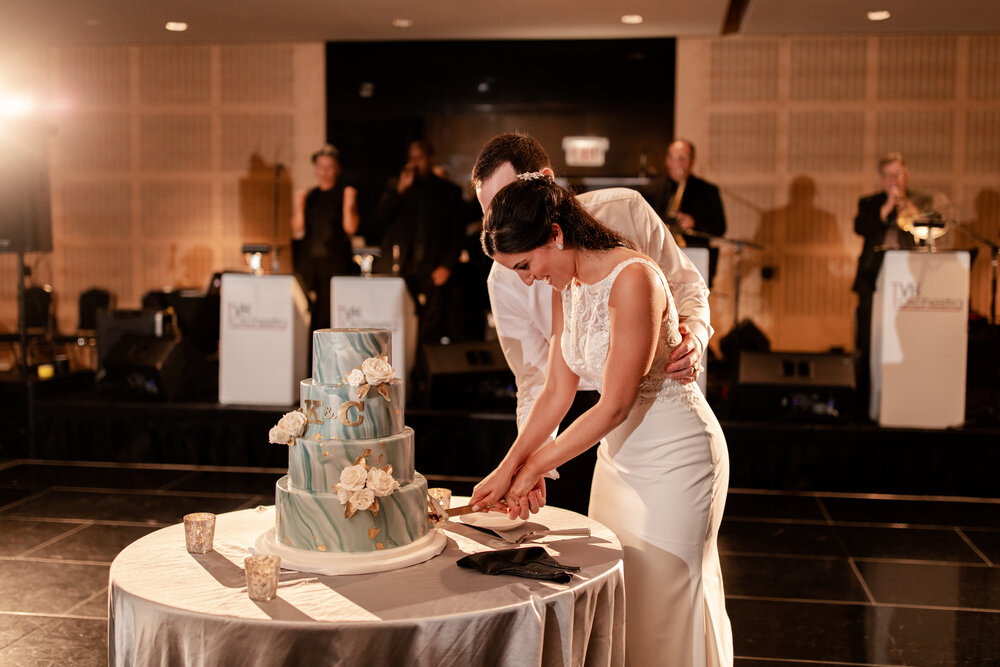 bride and groom cut cake at reception at Sofitel Chicago wedding