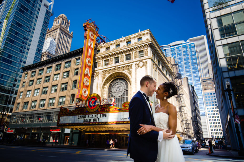 Chicago wedding venues couple in front of Chicago Theater