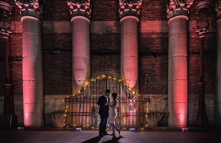 Couple in front of beams at Architectural Artifacts Chicago wedding venue