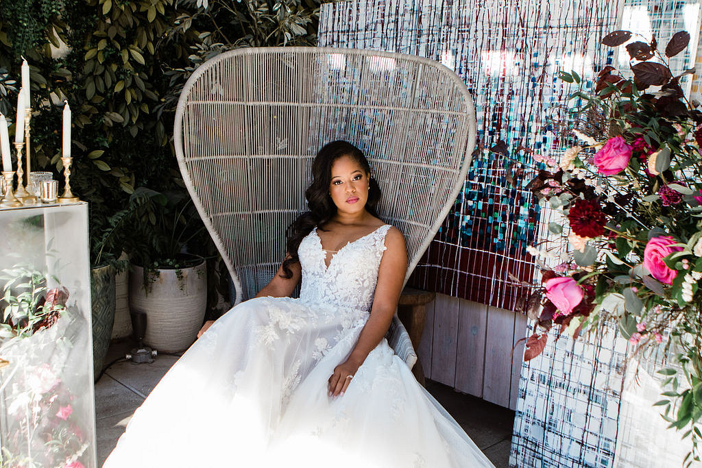 Bride poses in chair at Dalcy wedding Chicago photoshoot