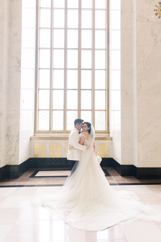 Bride and groom in the historic lobby of The Old Post Office Chicago wedding venue 