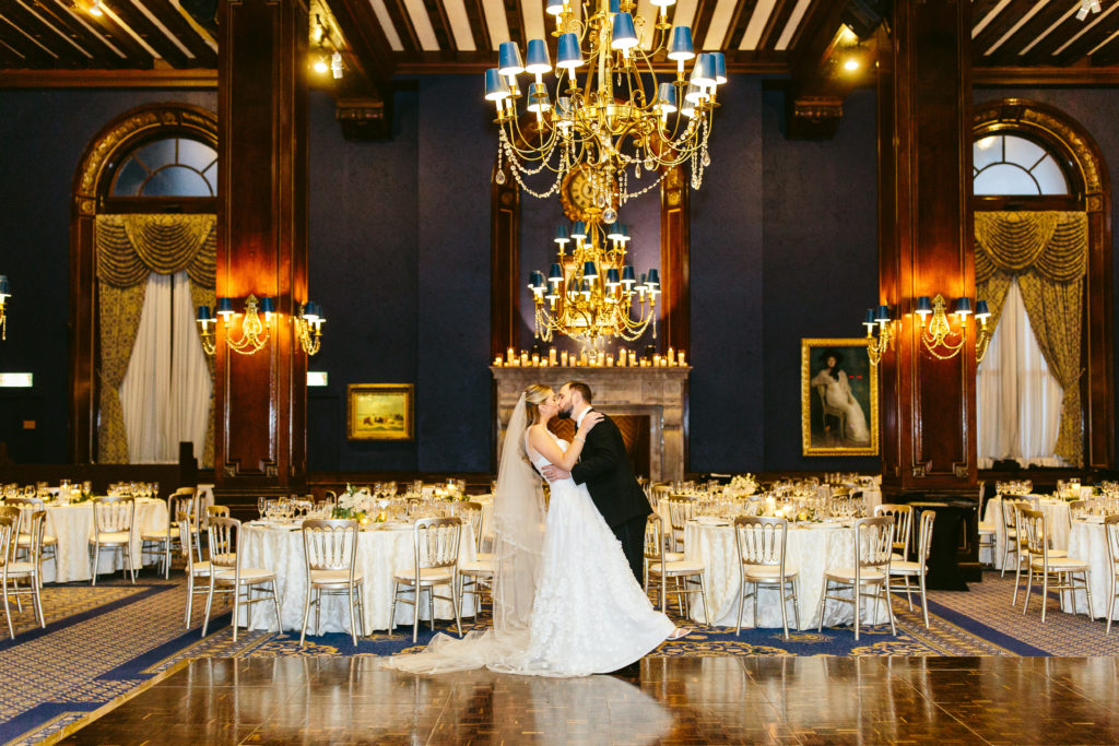 Bride and groom kissing at their at the Union League Club of Chicago wedding reception