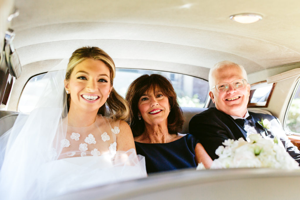 Bride and family driving to at the Union League Club of Chicago wedding