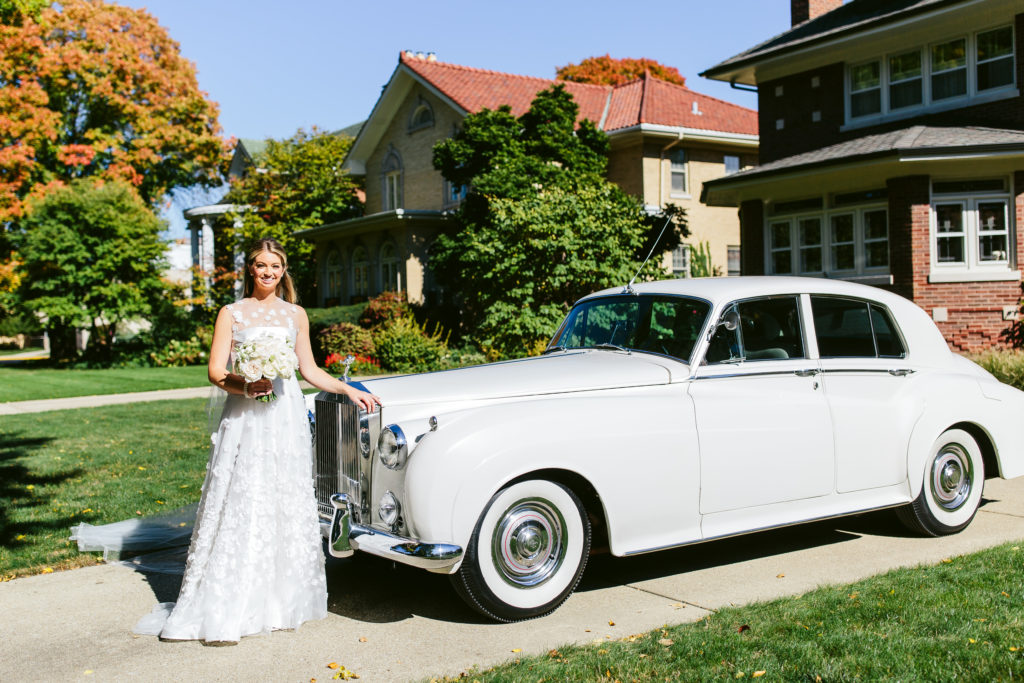 Bride with an old car