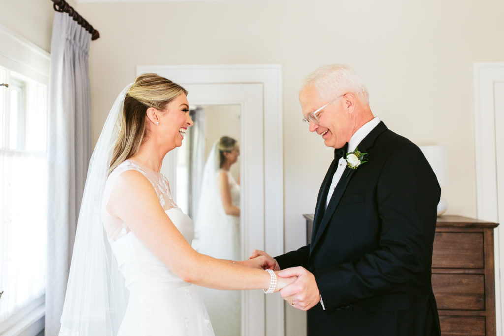 Smiling bride with her father