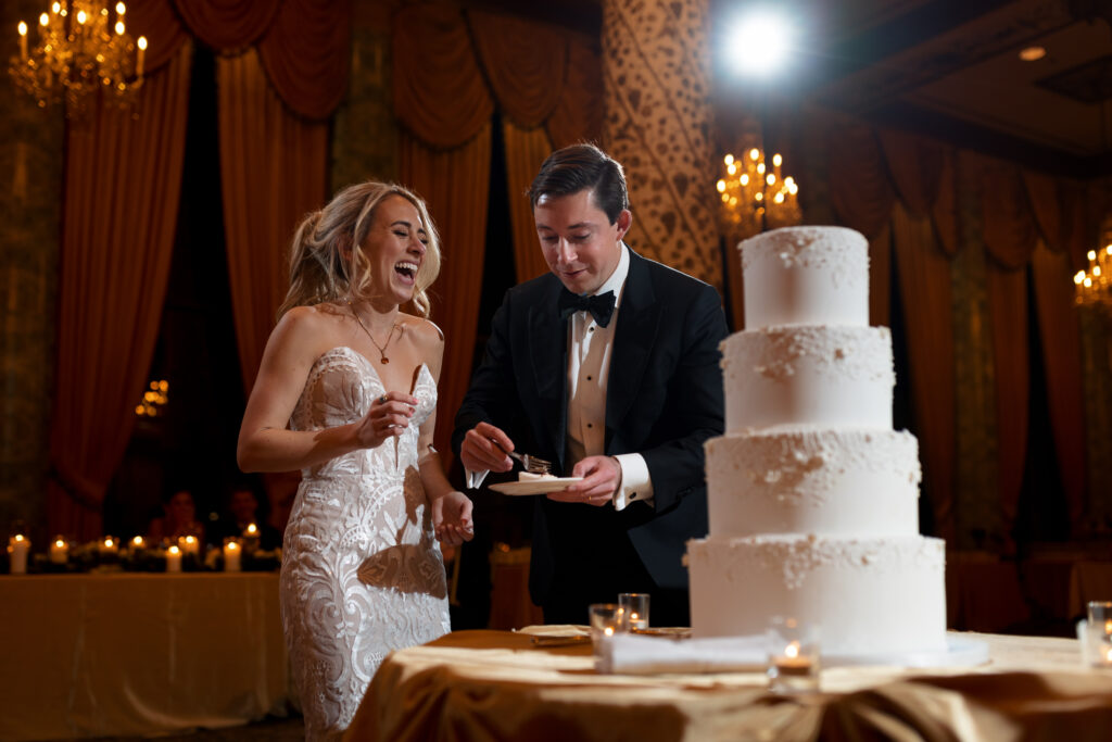 Bride and groom cutting cake at their wedding at The Drake in Chicago
