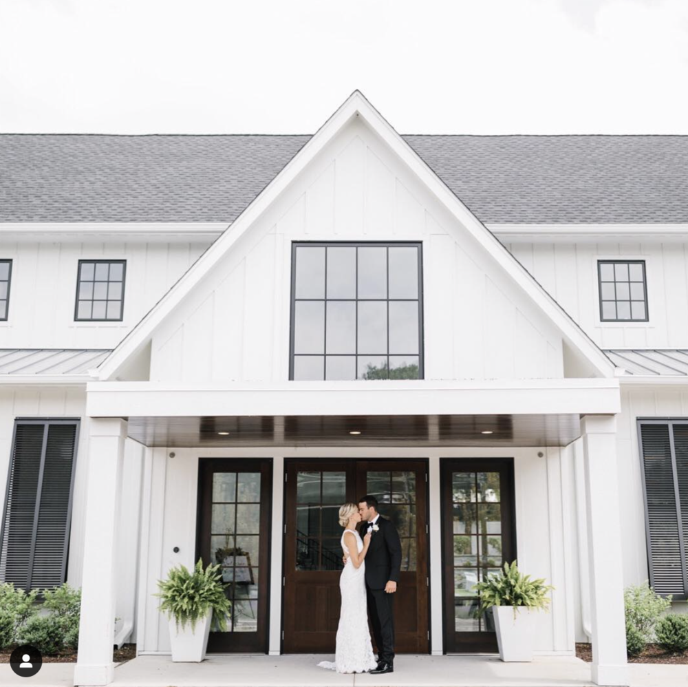 Wedding couple in front of The Hutton House venue