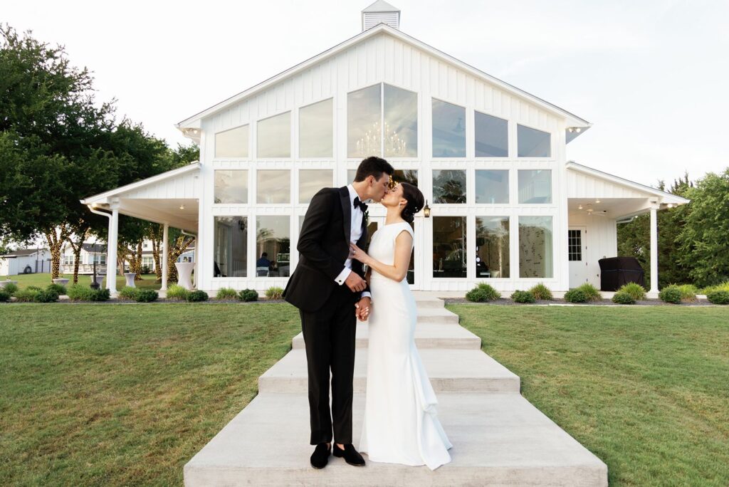 Wedding couple posing outside of DFW wedding venue