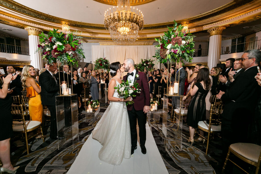 Intercontinental Chicago Ballroom bride and groom post ceremony aisle kiss