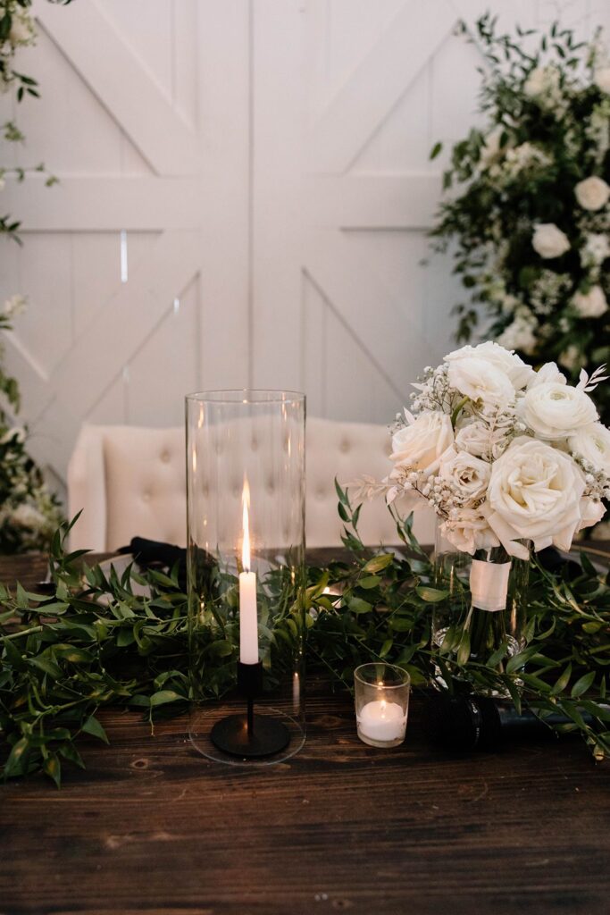 romantic head table candlelit with tufted couch