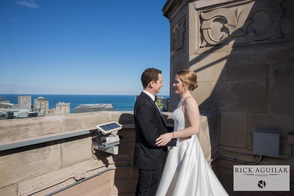 Rooftop views of Lake Michigan with bride and groom