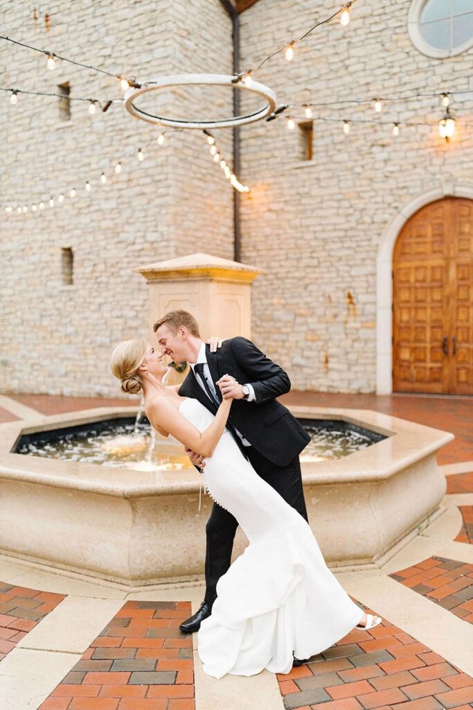 wedding couple on piazza by fountain