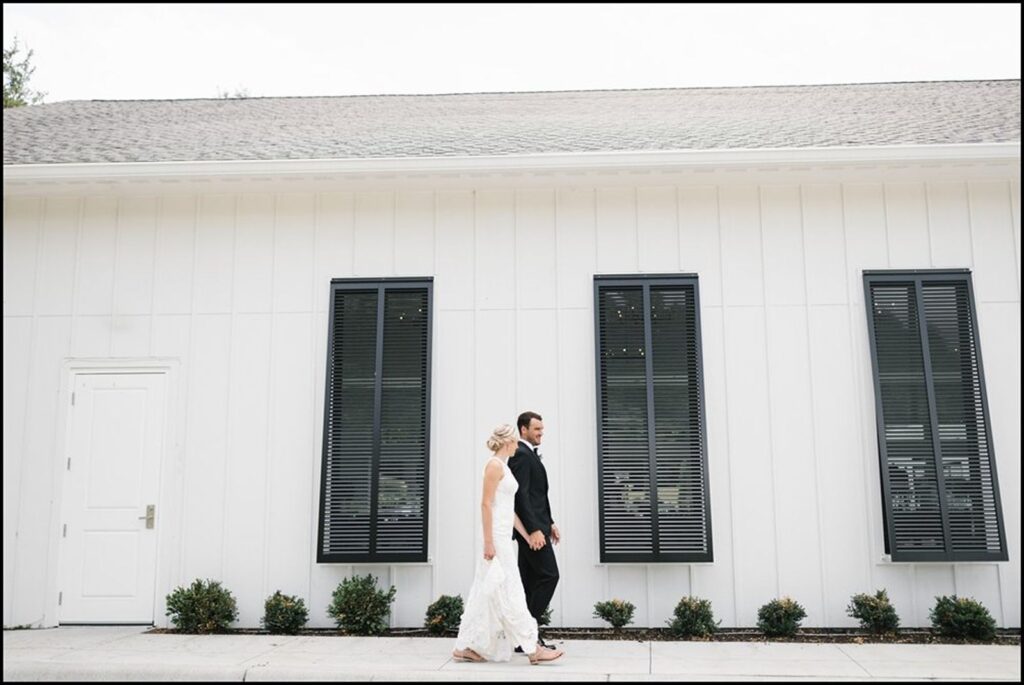 The Hutton House wedding couple walking outdoors