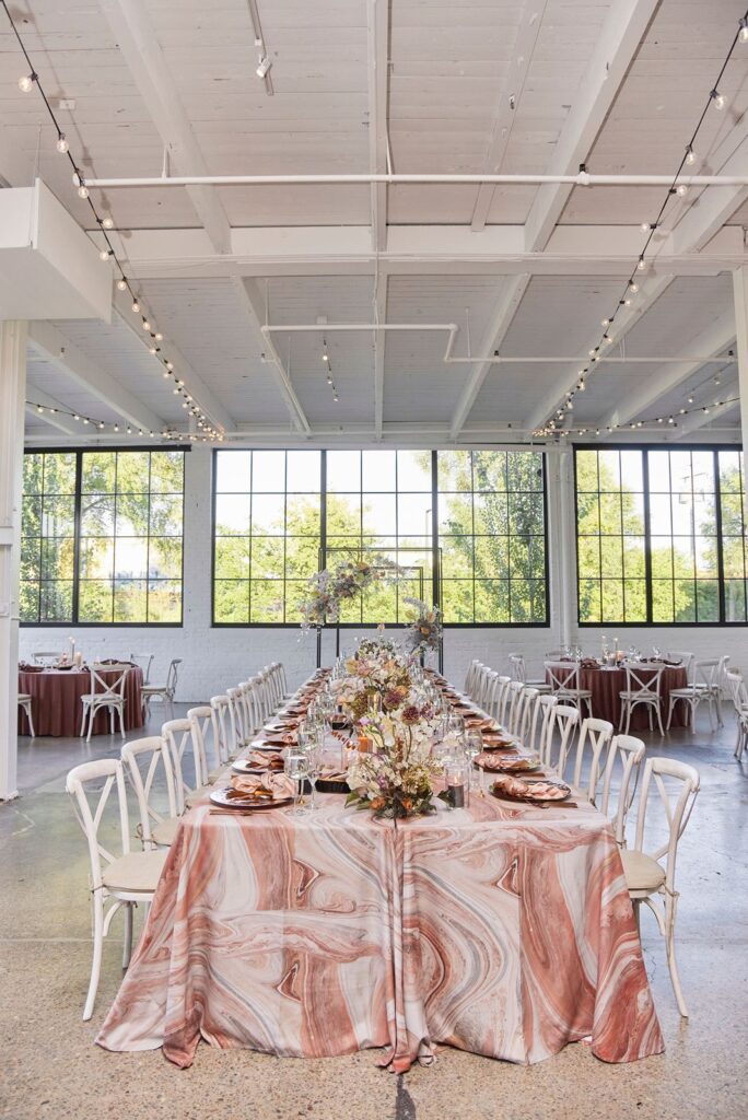 Pink watercolor linens at wedding reception at The Whim venue