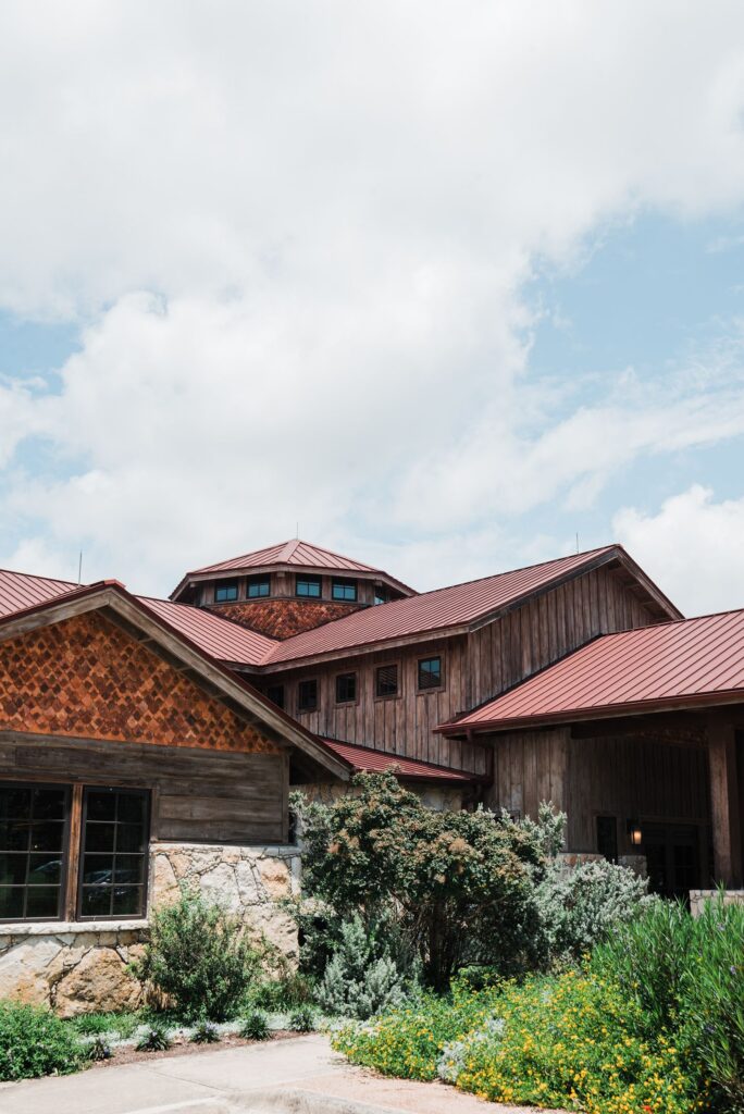 Exterior of Sacred Oaks at Camp Lucy, a Dripping Springs wedding venue.
