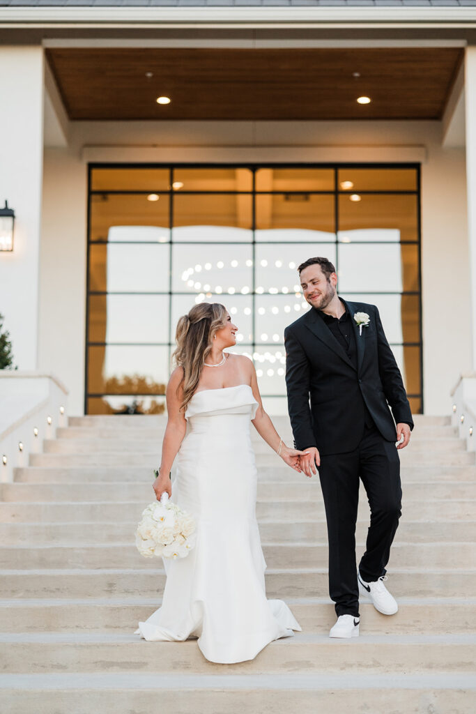 Bride and groom on stairs outside The Arlo wedding venue